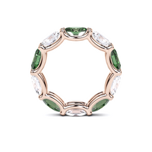 Oval Cut Emerald and Diamond Ring